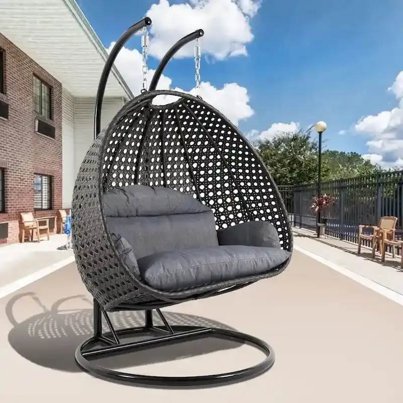 LeisureMod 2-Person Rattan Wicker Hanging Egg Chair With Stand and Cushioned Lounger